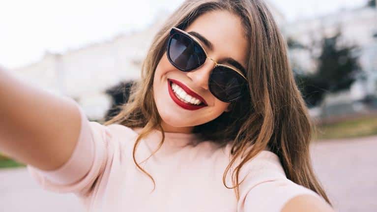 woman with red lipstick smiling l dentist seattle wa
