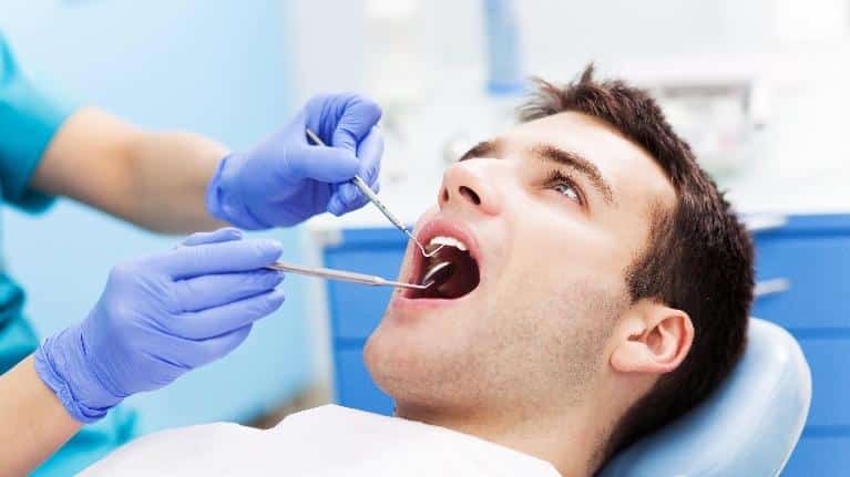 Man Getting Dental Exam | Phinney Ridge Dental